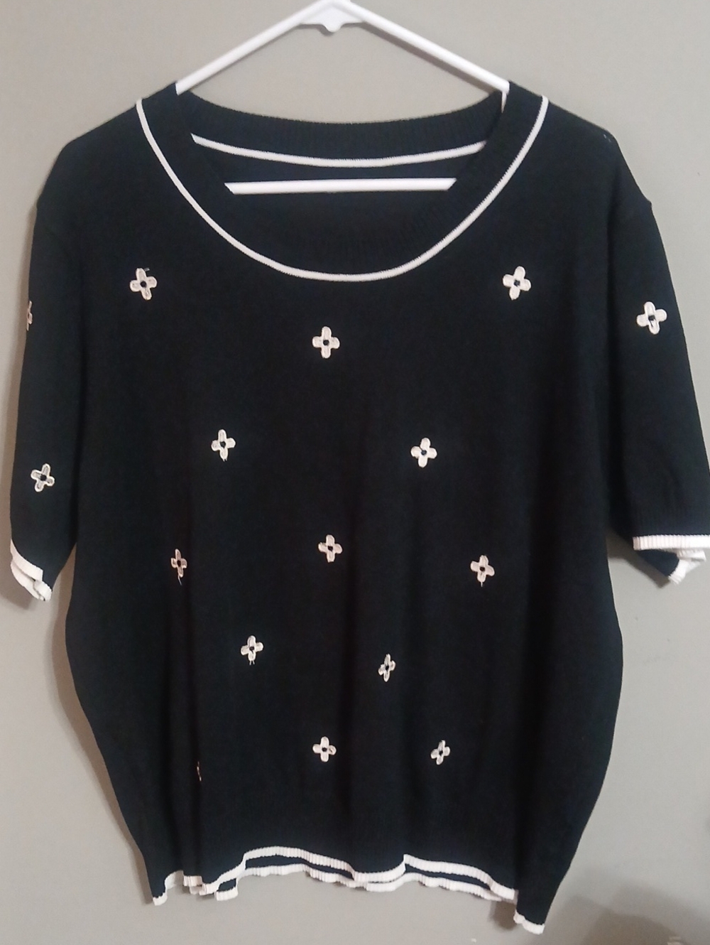 Black Short-Sleeve Knit Top with White Floral Accents